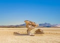 Arbol de Piedra tree of rock, the famous stone tree rock formation created by wind, in the Siloli desert in Bolivia Royalty Free Stock Photo