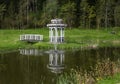 Arbor with a bridge on a pond Royalty Free Stock Photo