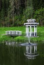 Arbor with a bridge on a pond Royalty Free Stock Photo