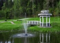 Arbor with a bridge on a pond Royalty Free Stock Photo