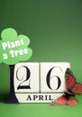 Plant a Tree on Arbor Day with white block calendar for April 26 - vertical with copy space