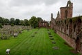 Courtyard with ruins of medieval Arbroath Abbey in Scotland in cloudy weather