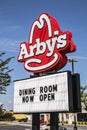 Arby`s restaurant street sign with Now Open message Royalty Free Stock Photo