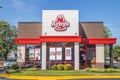 Arbys fast food restaurant clear blue sky signs in window