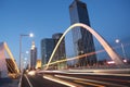 Arc bridge girder highway car light trails city night landscape Royalty Free Stock Photo