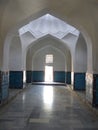 Arcs and corridor inside a religious building in Uzbekistan.