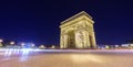 Arc de Triomphe and blurred traffic at night Royalty Free Stock Photo