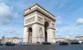 Arc de Triomphe at Charles de Gaulle square with car traffic - Paris