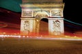 Arc de Triomphe at night in Paris, blurry night traffic lights Royalty Free Stock Photo