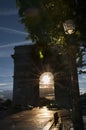 Arc de Triomphe with sunset in the middle Royalty Free Stock Photo