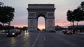 Arc de Triomphe view from Champs-Elysees with traffic at dusk in Paris