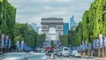 Arc de Triomphe viewed up the Champs Elysees with traffic timelapse. Paris, France Royalty Free Stock Photo