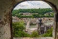 Arc window view of beautiful Dinant city from citadel of dinant, namur, belgium