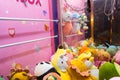 Close up to toys machine at shopping mall. Arcade claw machine toys crane game Royalty Free Stock Photo