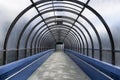 Arcade of an empty pedestrian elevated tunnel that narrows