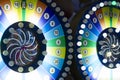 Arcade gambling machine up close. Giant wheel with colorful sections and lights