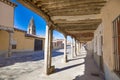 Medieval arcaded street and church tower in Ampudia old town