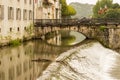 Arcades of the old bridge over the river Salat villa of Saint Girons. Ariege France