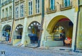 Arcades in medieval townhouses on Kramgasse street is occupied with stores and restaurants in Bern, Switzerland