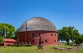 Arcadia round barn with red oak boards and grey roof, is a landmark next to route 66. Arcadia, Oklahoma, US