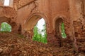 An arch in an abandoned old church made of red brick. View from the inside. Russia, Smolensk region, 1753 Royalty Free Stock Photo