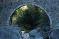 Arch of ancient Roman bridge over a mountain river in the Kesme Bogazi canyon, Turkey Royalty Free Stock Photo