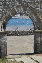 Arch of the beautiful collapsed wall of the church of San Pedro overlooking the fishing port on the Paseo Maritimo in