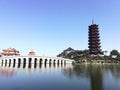 The arch bridge and the ancient tower of the university campus.