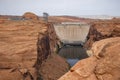 Arch Bridge Over Colorado River Amidst Rocky Landscape Royalty Free Stock Photo