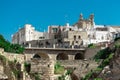 Arch bridge at Polignano a Mare, beautiful city with a beach between the city cliffs. Colorful picture of a picturesque village in Royalty Free Stock Photo