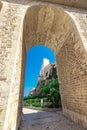 Arch bridge at Polignano a Mare, beautiful city with a beach between the city cliffs. Colorful picture of a picturesque village in Royalty Free Stock Photo