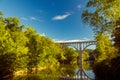 Arch bridge spanning a river in Cuyahoga Valley National Park