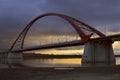 Arch of the Bugrinsky bridge against the background of a contrasting dawn sky Royalty Free Stock Photo