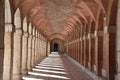 Arch column walkway with shadows in Aranjuez