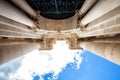 Arch and columns with capitals. Blue sky and clouds Royalty Free Stock Photo