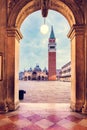 Arch columns on Piazza San Marco with basilica in Venice, Italy Royalty Free Stock Photo