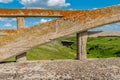 Arch from concrete bridge in Scotsguard, SK with a historic railway tressle in the background Royalty Free Stock Photo