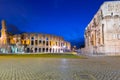 Arch of Constantine and the Colosseum illuminated at night in Rome, Italy Royalty Free Stock Photo