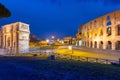 Arch of Constantine and the Colosseum illuminated at night in Rome, Italy Royalty Free Stock Photo