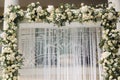 Arch decorated with flowers at the wedding caremony