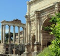 Arch of Emperor Septimius Severus and Temple of Saturn at the Roman Forum in Rome Royalty Free Stock Photo