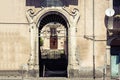 Arch, entrance of old houses, historical street of Catania, Sicily, Italy