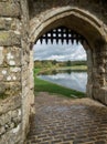 Arch at the entrance to Leeds Castle near Maidstone in Kent, UK, with the moat behind Royalty Free Stock Photo