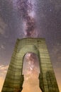 The Arch of Freedom monument Purple Milky way falling stars