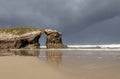 Arch hole in the rock formation at the beach of the Cathedrals