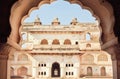 Arch in indian palace. Example of classical architecture of India. Towers of historical structure, walls and balconies Royalty Free Stock Photo