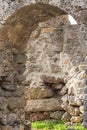 Arch lined stone limestone brown gray weathered broken ruins part of the old castle background design historic