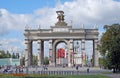 Arch of a main entrance at the All-Russia Exhibition Centre ENEA with a sculpture of the tractor operator and collective farmer.