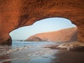 Arch in a mountain overlooking the sea