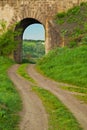 Arch in the old stone railway bridge